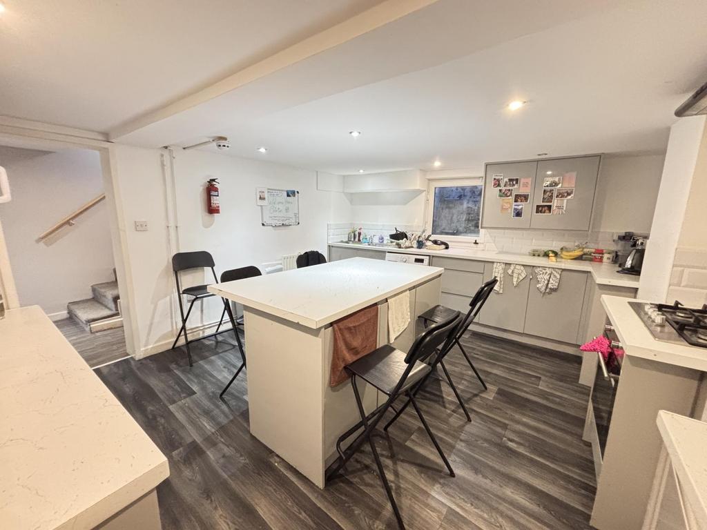 A modern, well-lit living room with ample space...