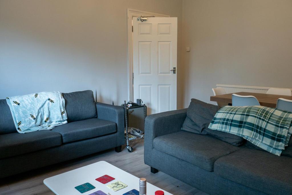 A modern, well-maintained living room featuring...