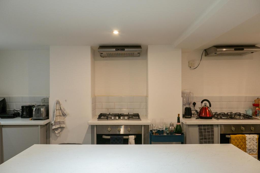 Modern kitchen area with appliances and bright ...