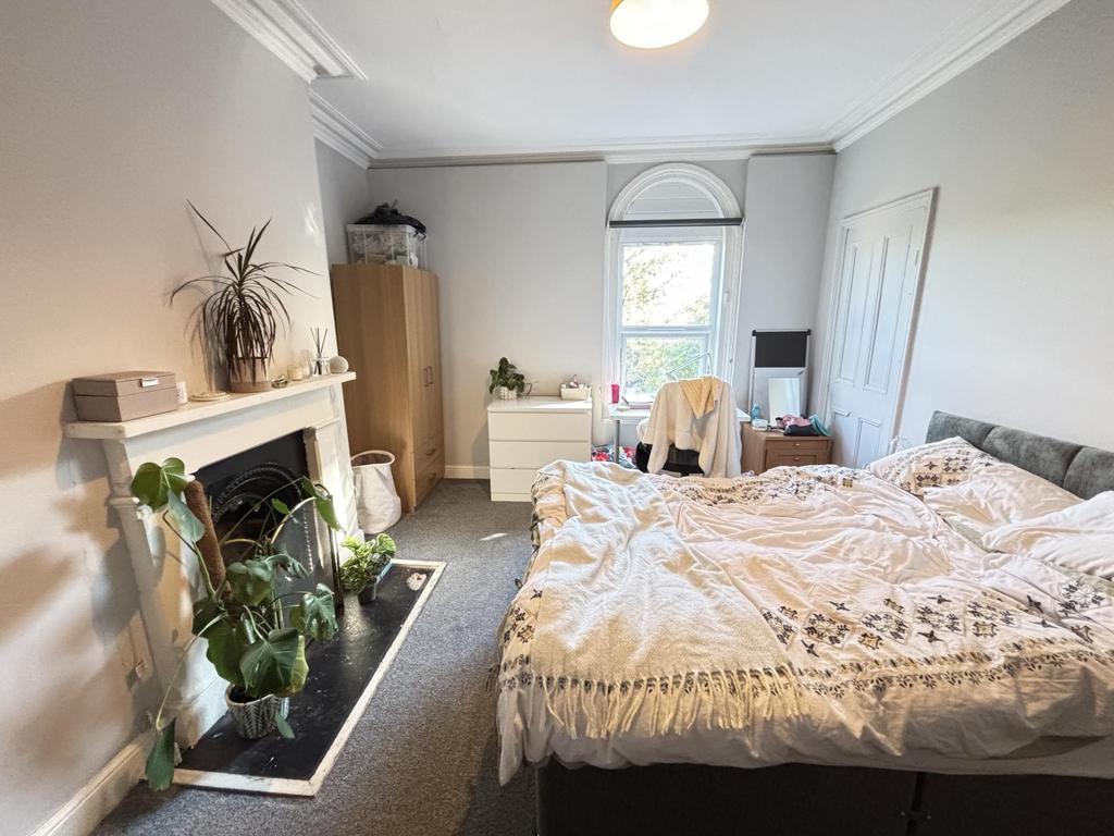 A spacious and well-maintained master bedroom f...