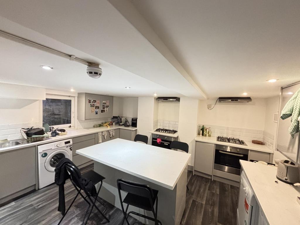 A bright, modern kitchen with ample workspace a...