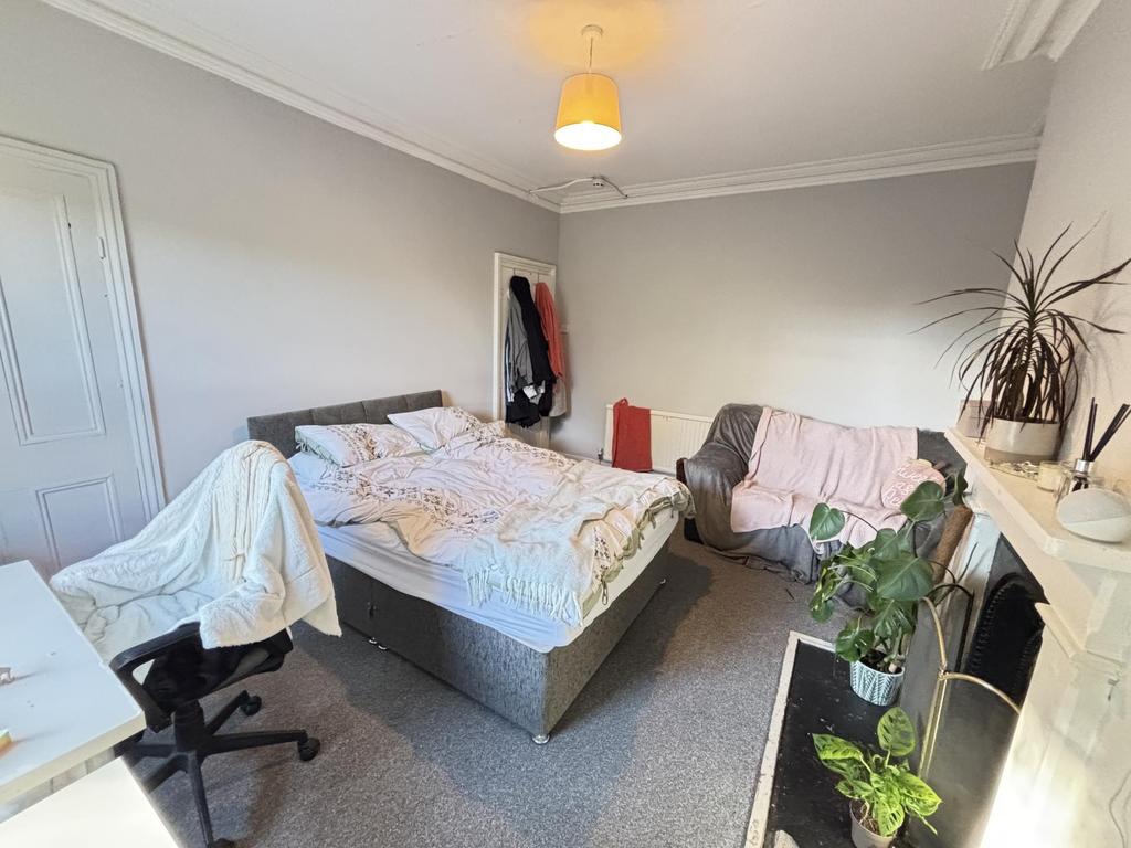 A spacious and well-maintained master bedroom f...