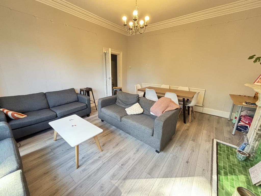 A spacious and well-maintained living room with...