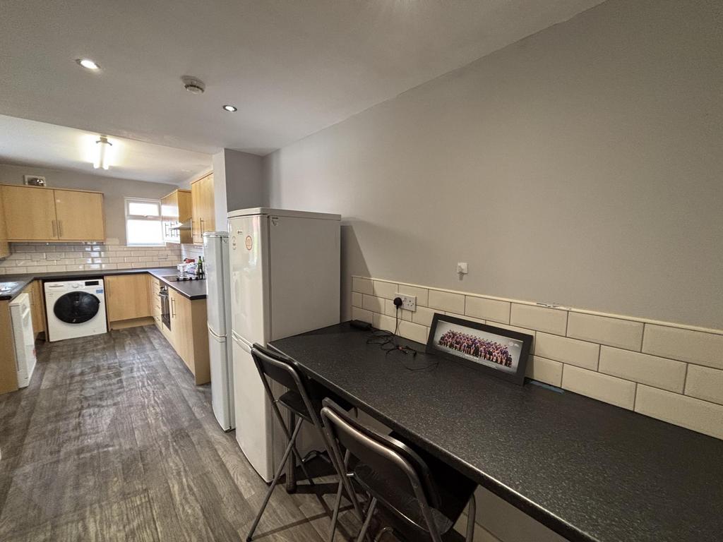 A modern kitchen area with a clean, well-mainta...