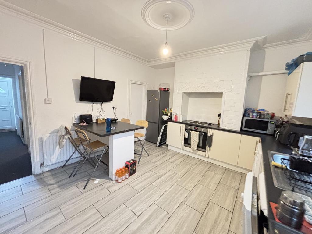 A bright and spacious living room with large wi...