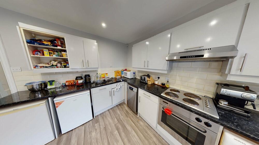 A modern, well-maintained kitchen featuring amp...