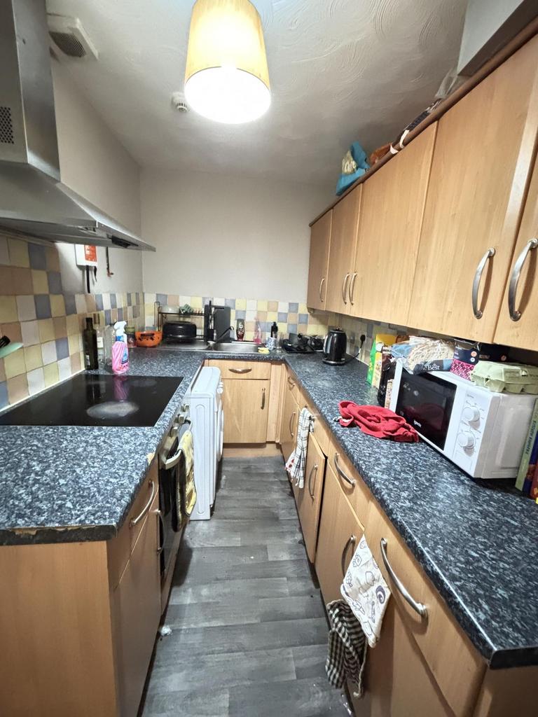 A compact and well-equipped kitchen featuring w...