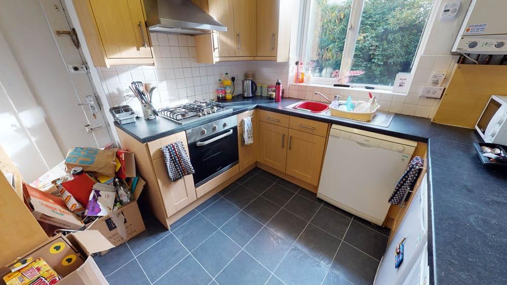 A well-used kitchen with a variety of appliance...