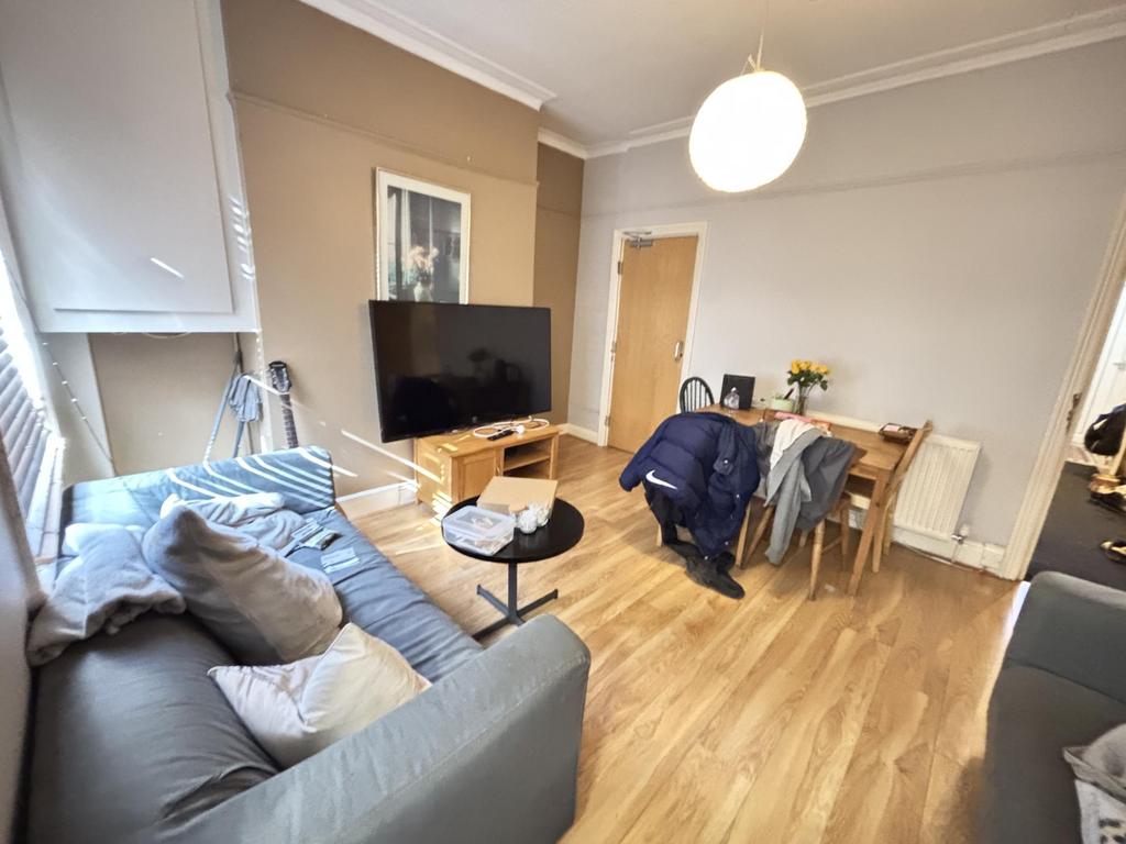 A bright and welcoming living room featuring a ...
