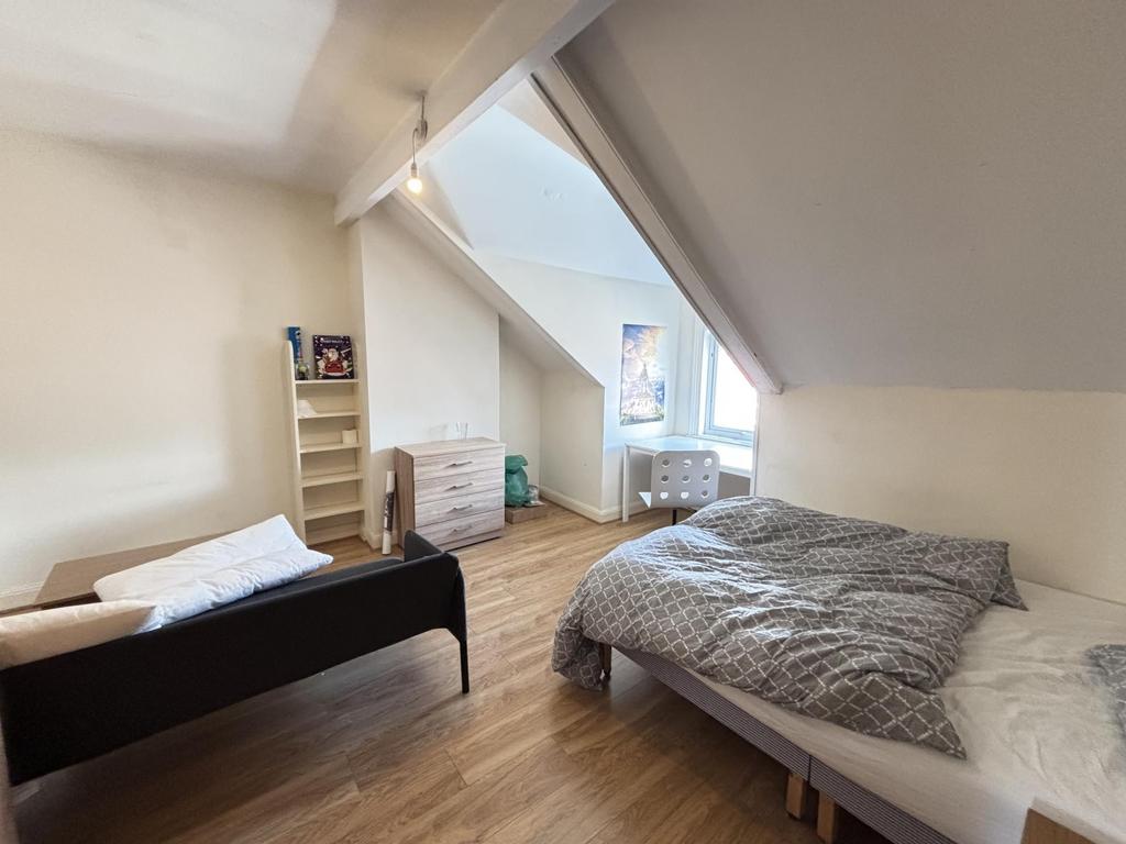 A spacious and well-maintained master bedroom f...