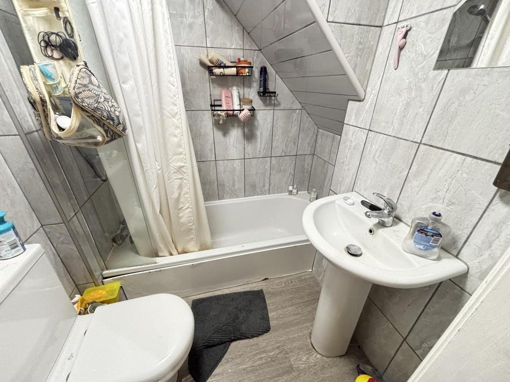 A clean and well-maintained bathroom with a sin...
