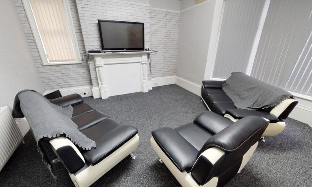 Modern and well-maintained living room with com...