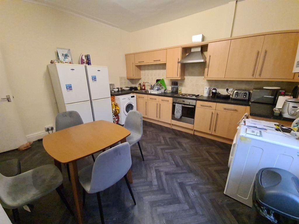 A bright and functional kitchen featuring ample...