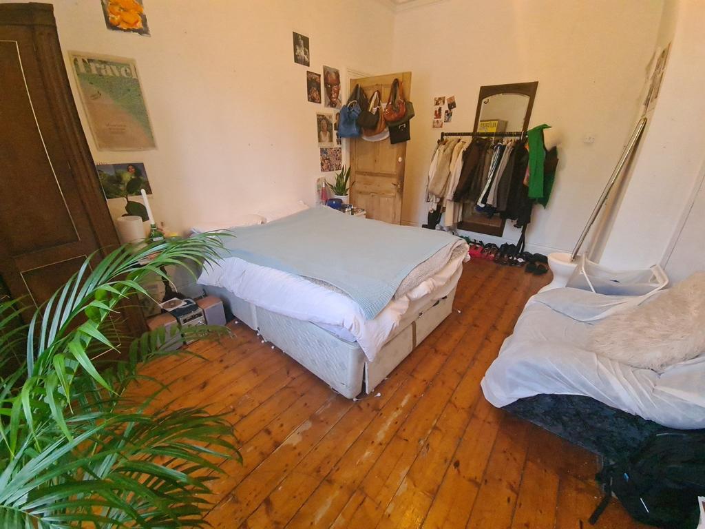 A cozy double bedroom featuring a comfortable d...