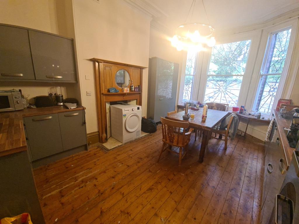 Spacious kitchen with charming wooden flooring ...