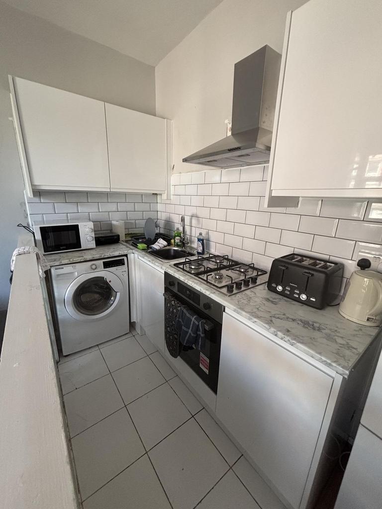 A modern, well-maintained kitchen featuring whi...