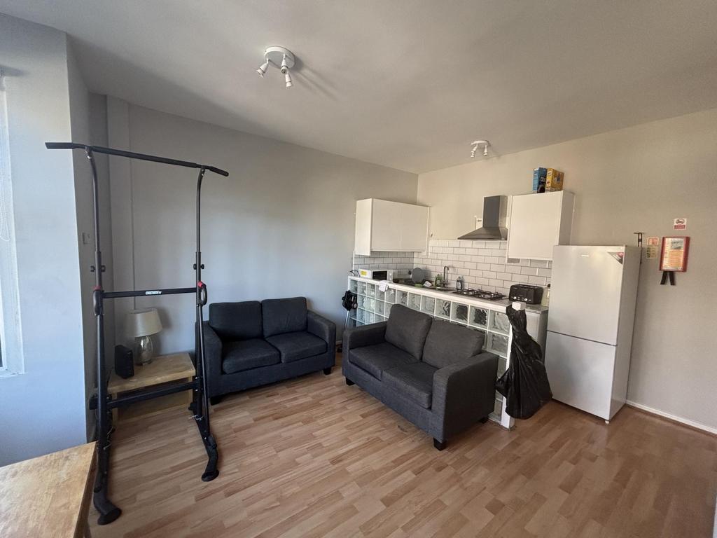 Bright and modern living room featuring a comfo...