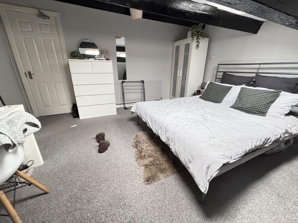 A spacious and well-maintained master bedroom f...