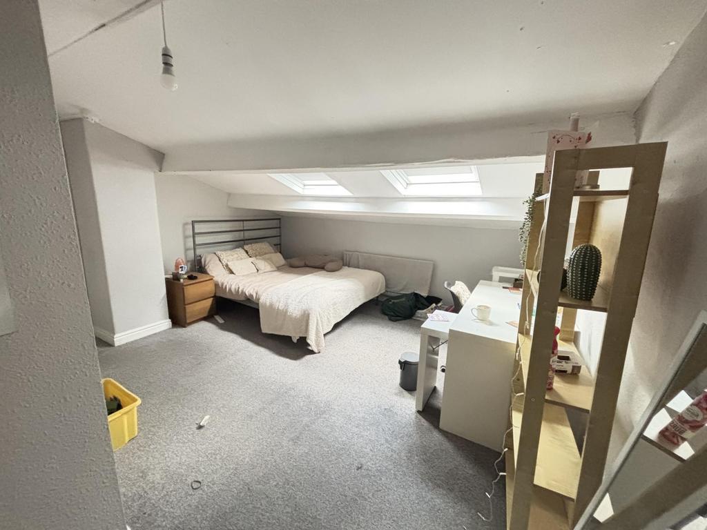 Bright and spacious master bedroom featuring a ...