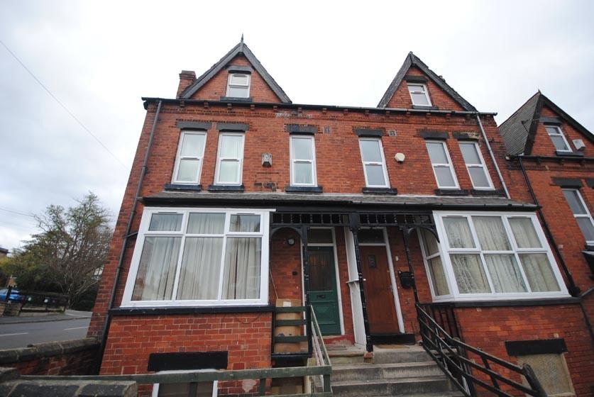 Charming brick-front exterior of a terraced hom...
