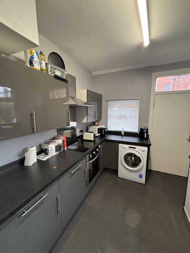 A well-maintained kitchen area with ample count...