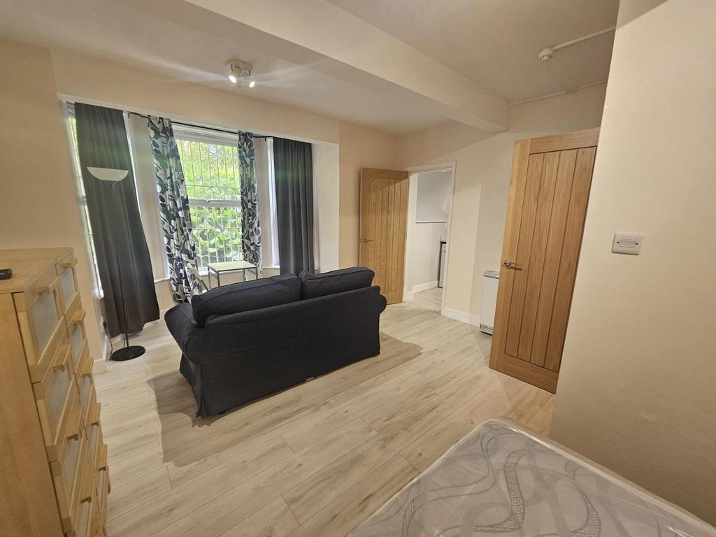 Spacious master bedroom featuring a comfortable...