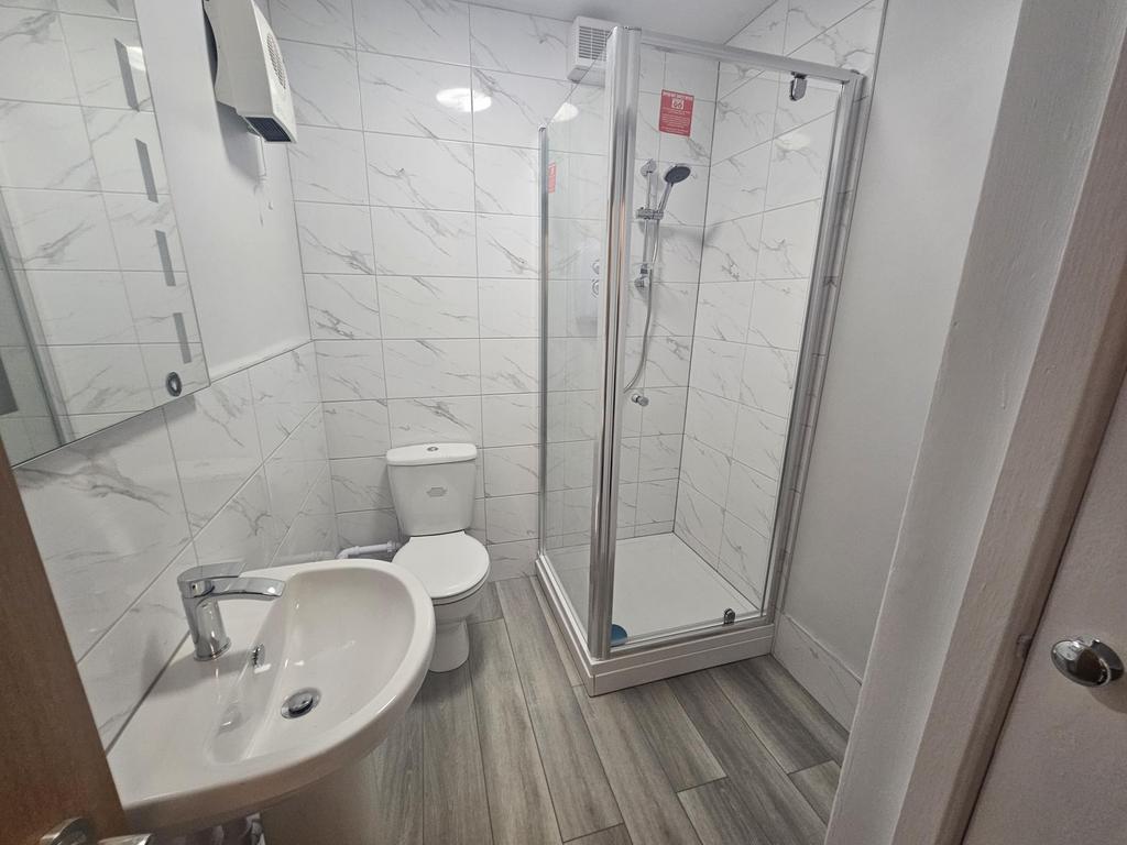 Bright and modern bathroom featuring a clean, g...