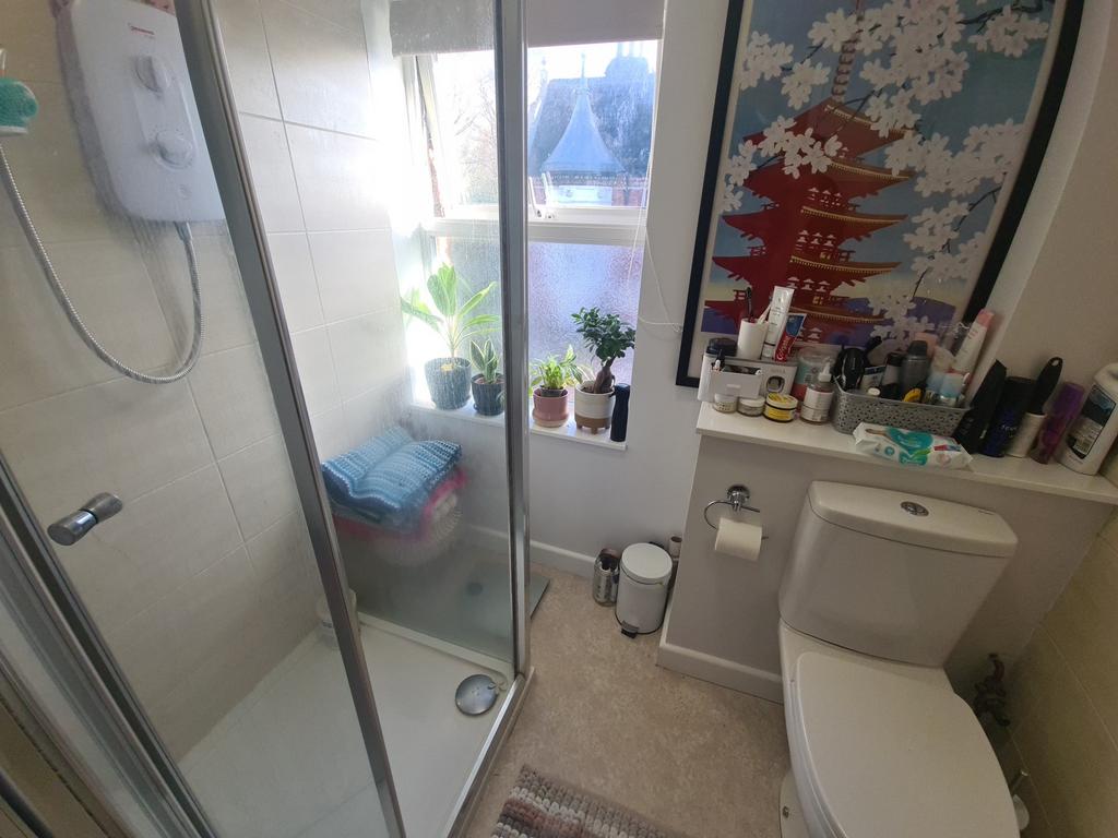 Bright, well-kept bathroom with a walk-in showe...