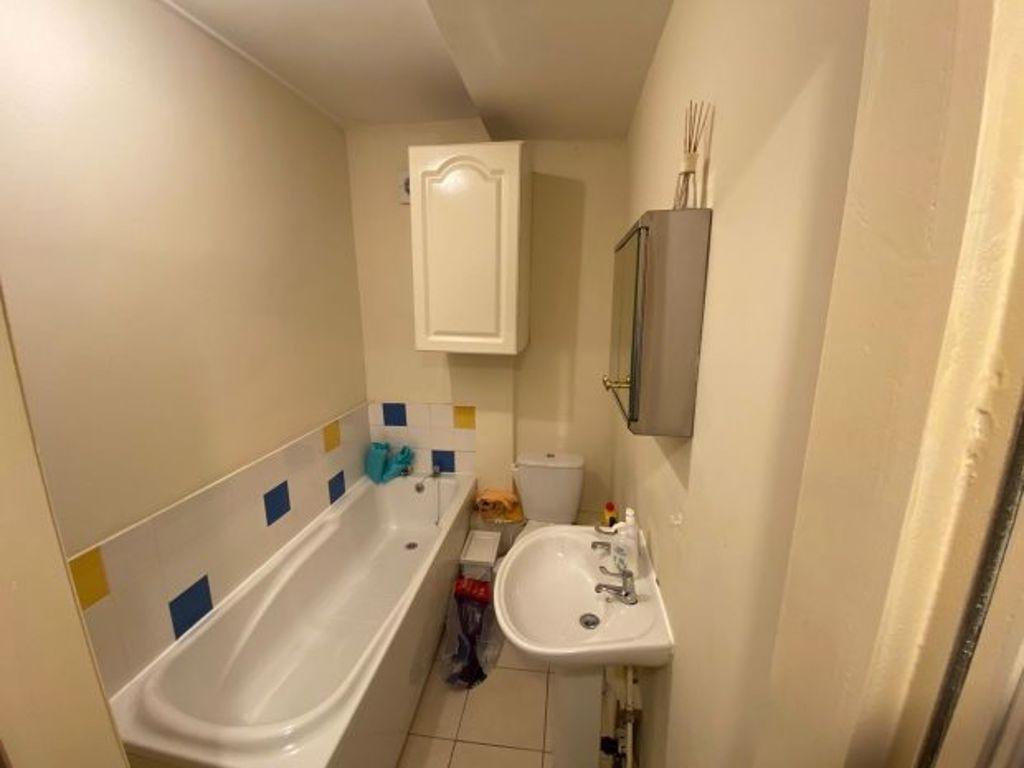 A clean and functional bathroom featuring a bat...