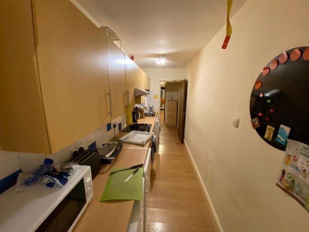 A well-equipped kitchen featuring ample cabinet...