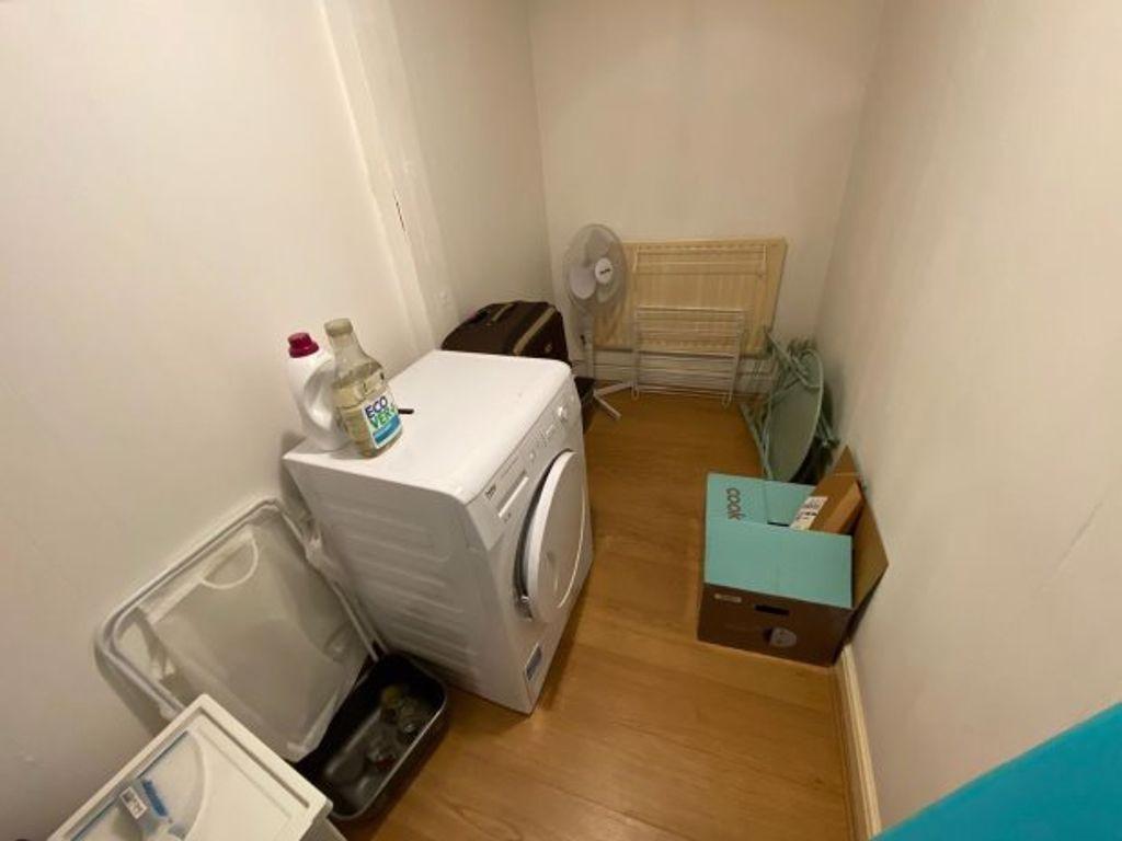 A neat and organized storage room featuring a w...