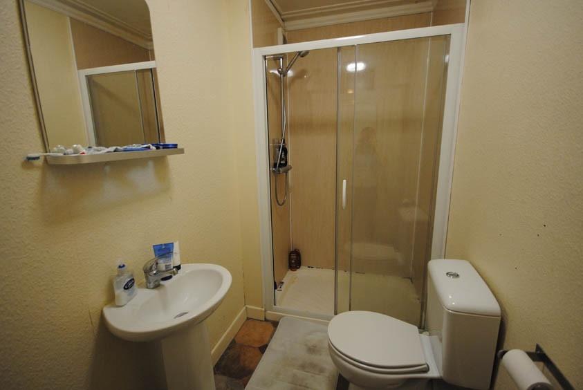 A clean and well-maintained bathroom with a sho...