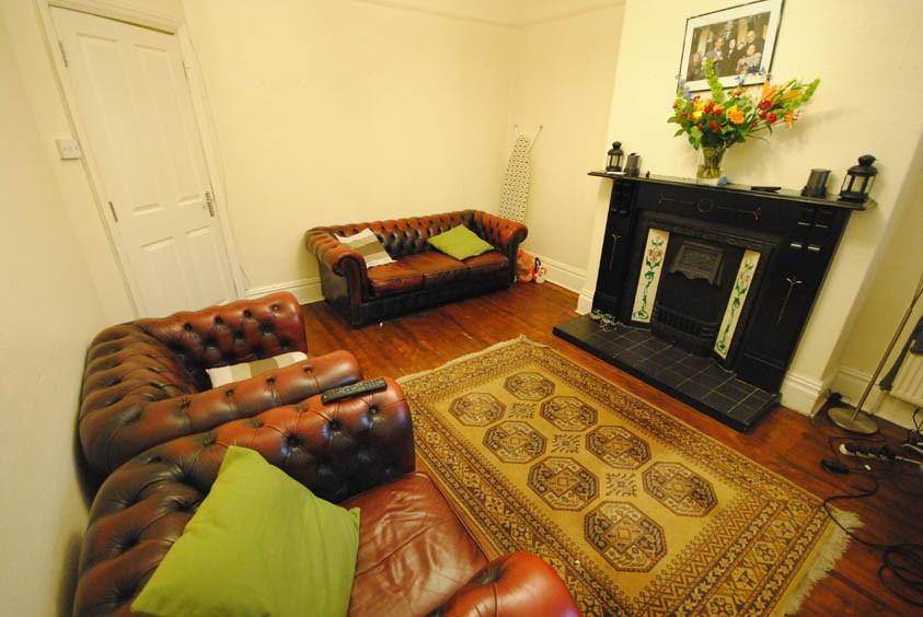 A spacious and well-maintained living room feat...