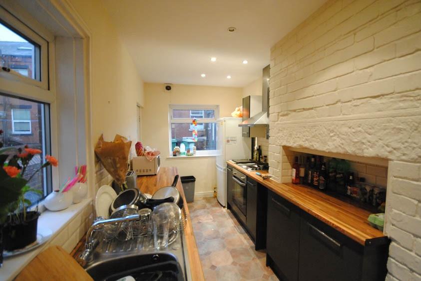 A bright and welcoming kitchen featuring modern...