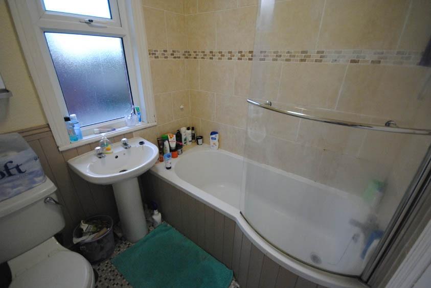 A clean and well-maintained bathroom with a bat...