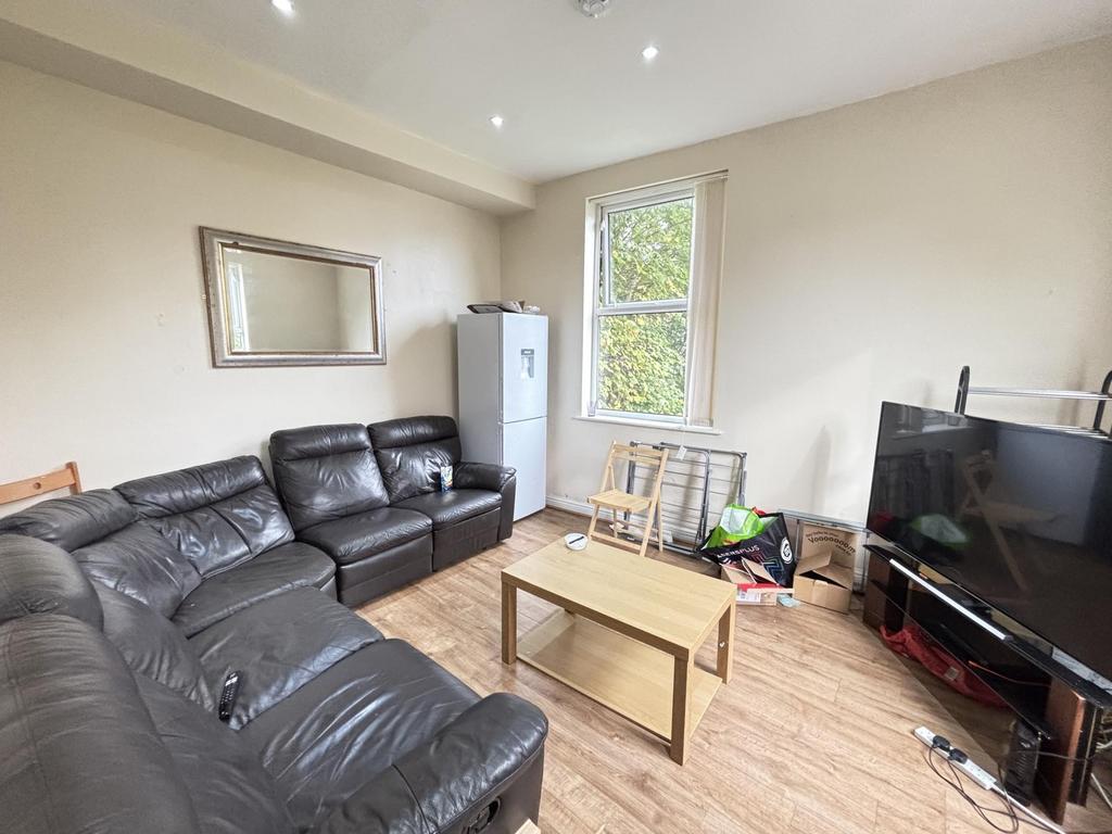 Spacious and well-lit living room featuring mod...