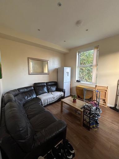 Bright and welcoming living room featuring larg...
