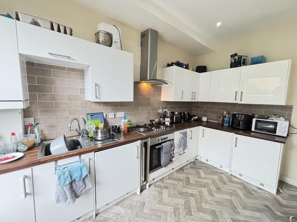 Bright and modern kitchen with ample workspace,...