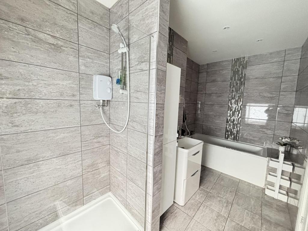 A modern, well-maintained bathroom featuring a ...