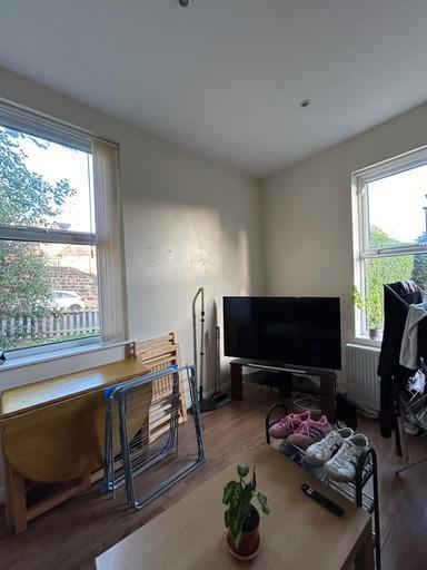 Bright and welcoming living room featuring larg...