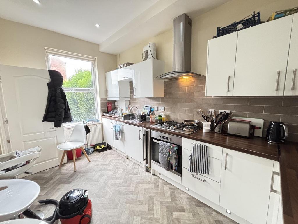 Bright and tidy kitchen with modern appliances ...