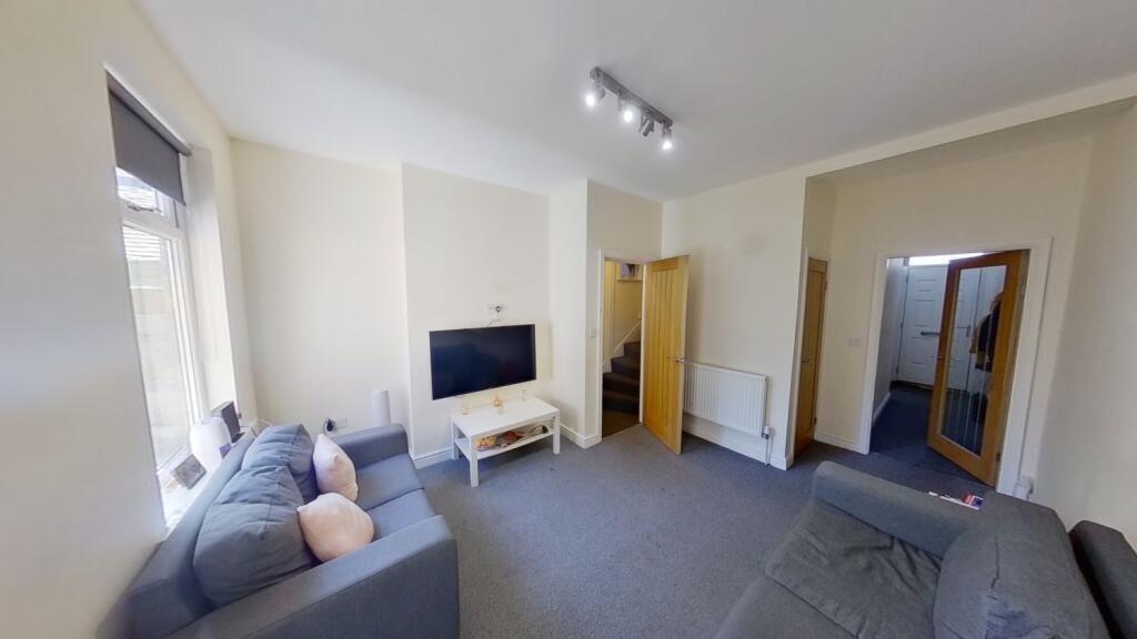 Bright, neutral living room with comfortable so...
