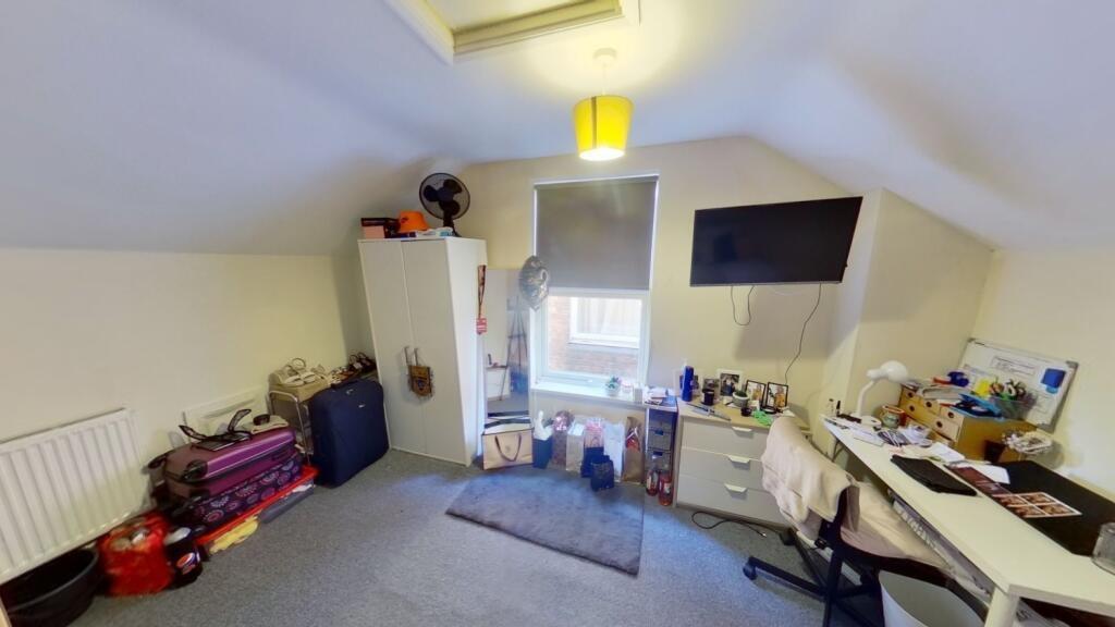 Bright attic double bedroom with sloped ceiling...