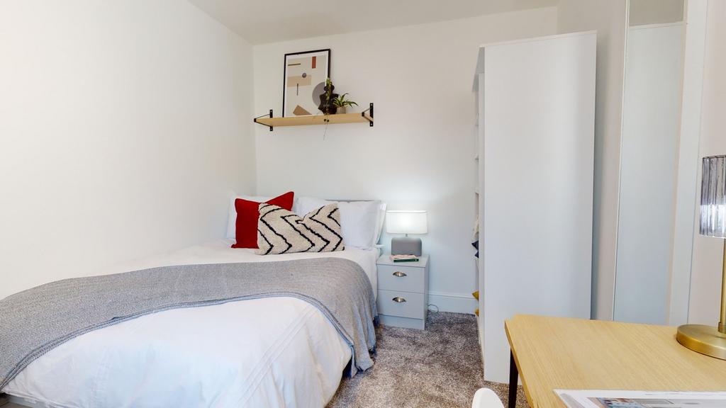 A cozy and well-decorated double bedroom, perfe...