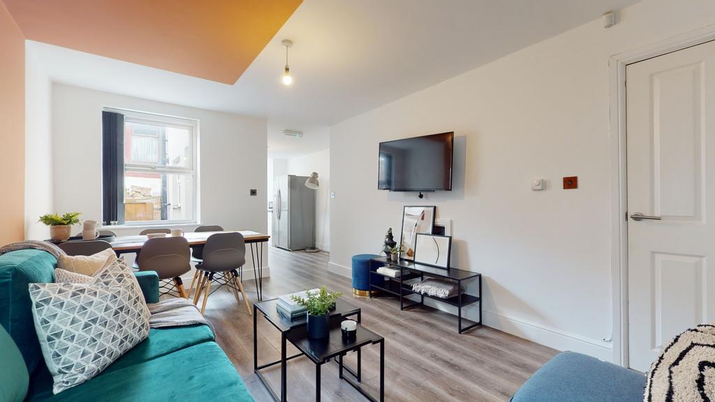 A spacious and inviting large modern living roo...