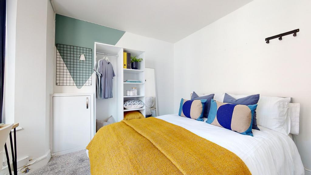 A stylish and spacious double bedroom featuring...