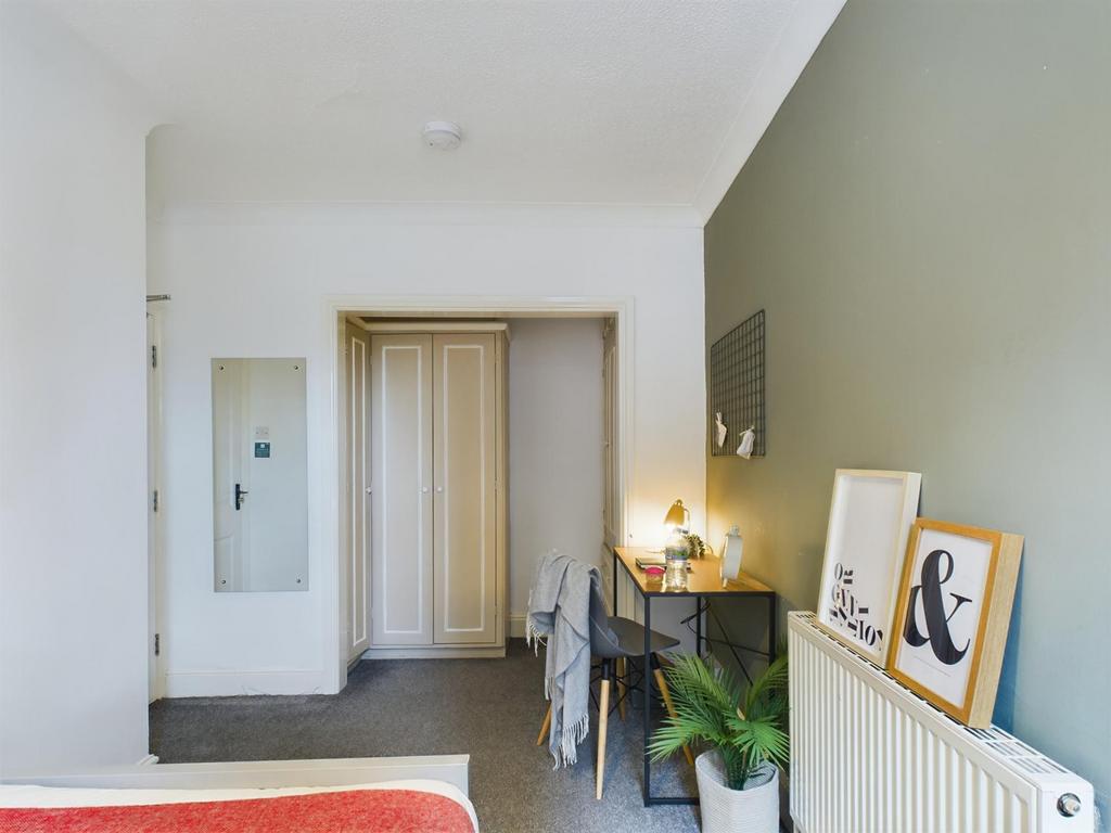 A bright and inviting double bedroom featuring ...
