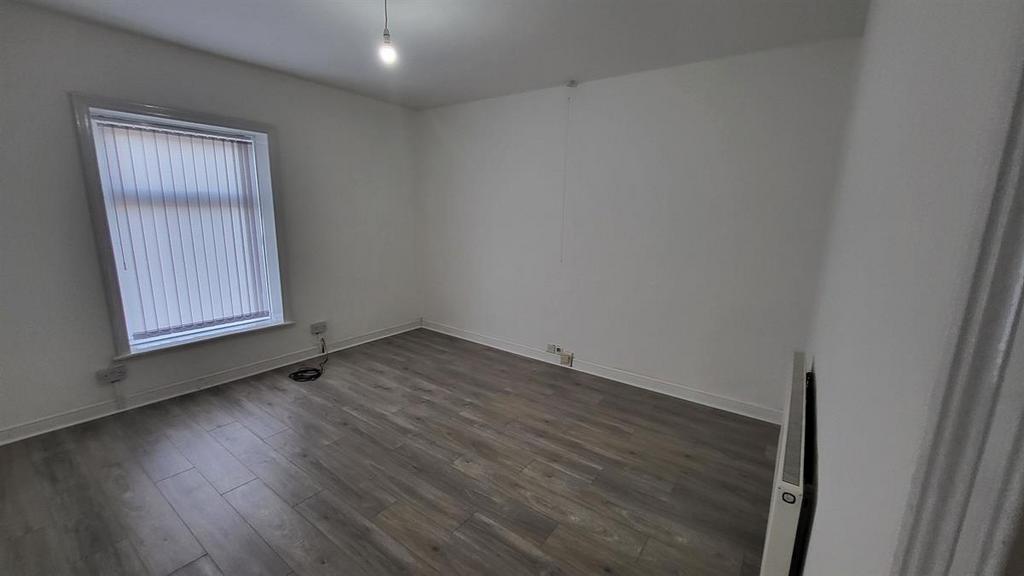 Bright, freshly redecorated bedroom with neutra...