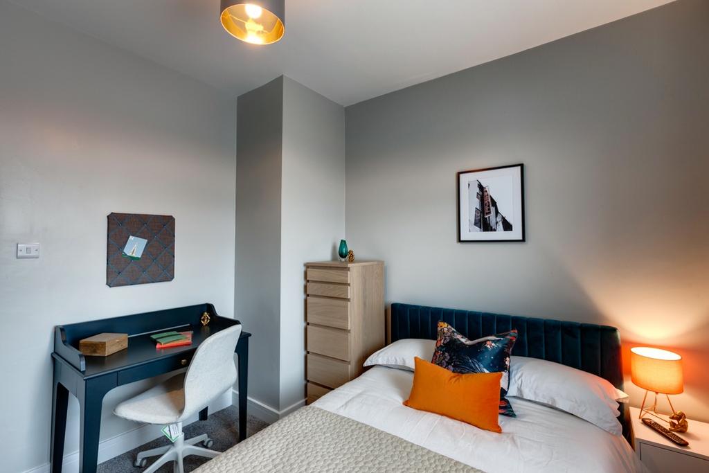 Bright, stylish double bedroom with a plush uph...