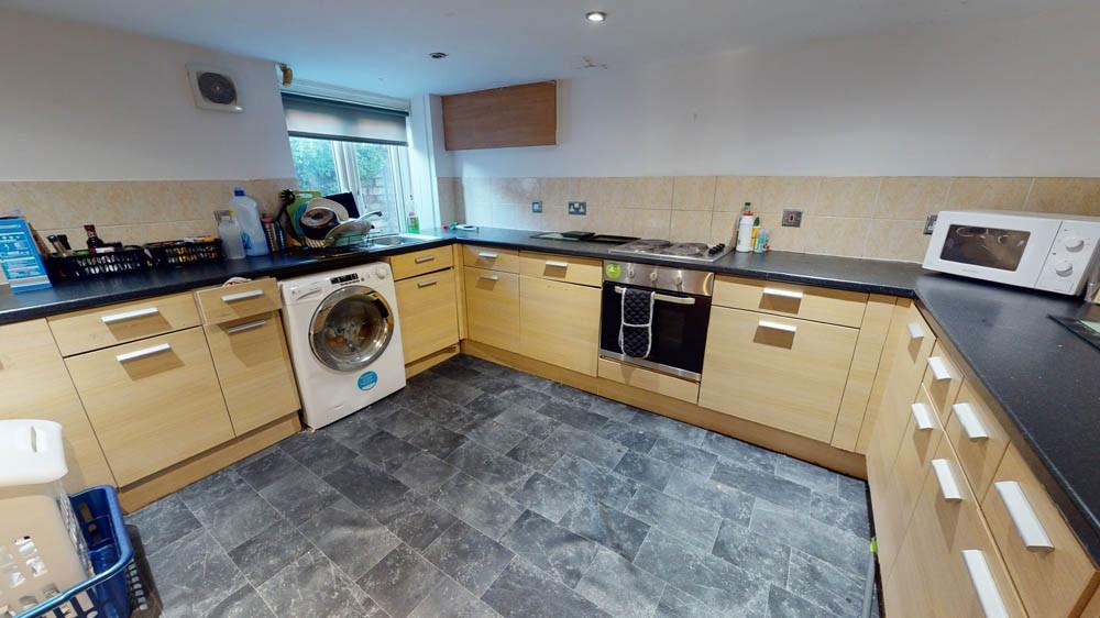 Bright and well-organized kitchen featuring amp...